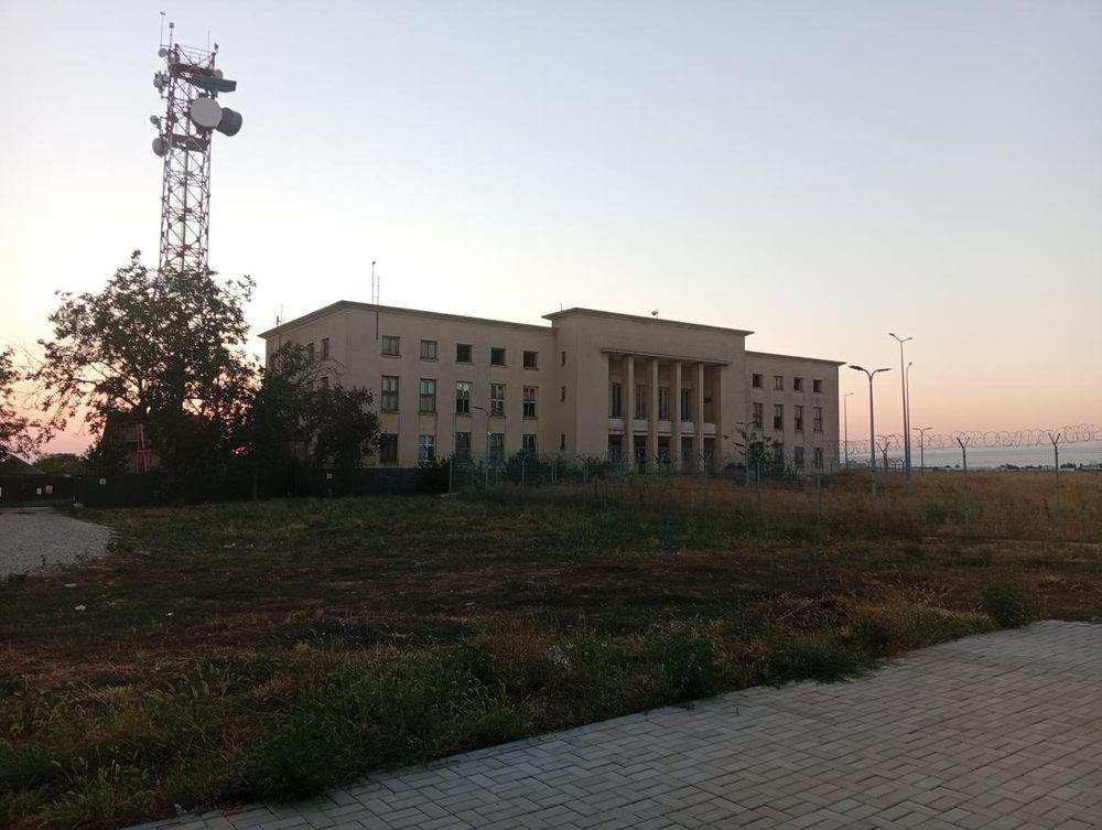 The old terminal behind the fence, still standing