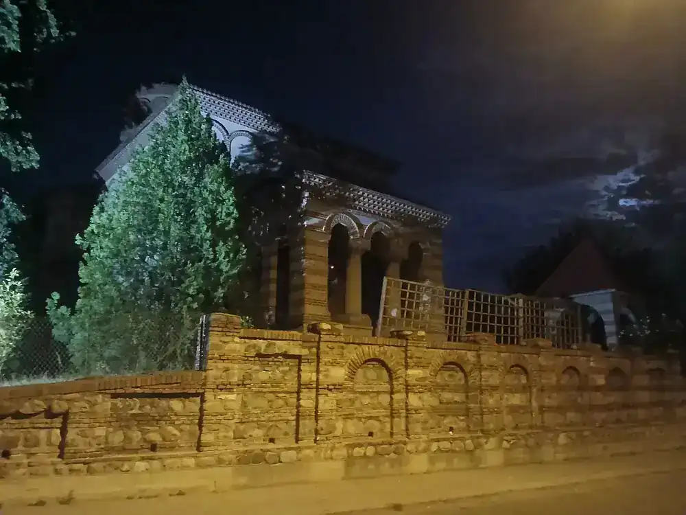 A church behind its walled yard, found on a night walk — not yet identified