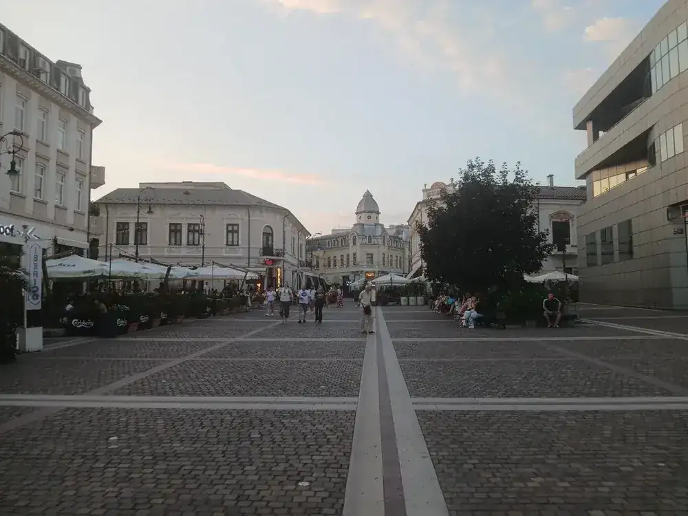 The square at dusk, terraces down both sides