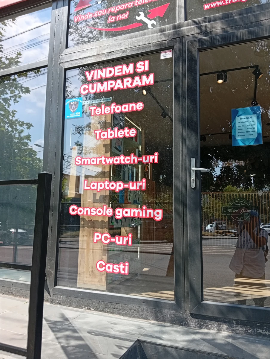 What they buy and sell, listed on the door — opening hours posted inside