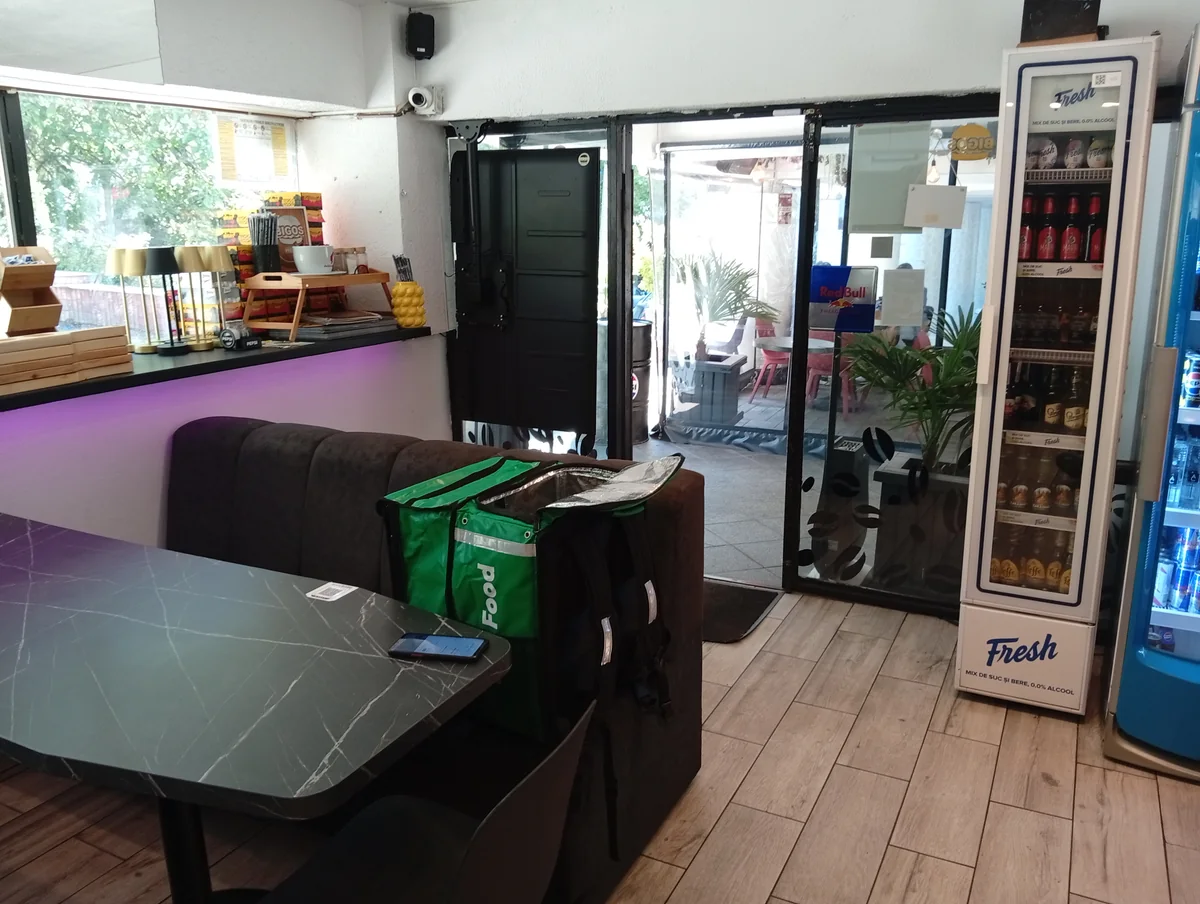 Inside: booths, the window bar and the door out to the covered terrace