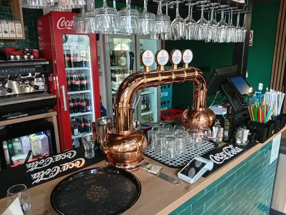 Copper taps and the coffee machine behind the bar