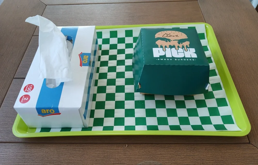 The box it came in — PICK, Smash Burgers. September 2026
