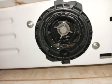 The empty filter housing with the pump wheel visible